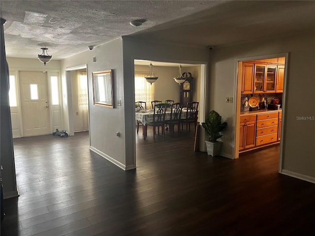 2065 Flamingo Dr, Bartow, FL 33830 - foyer featuring dark wood-style flooring and a textured ceiling