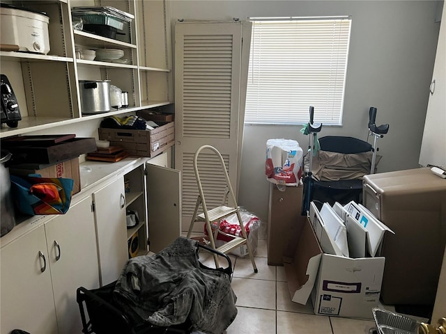 2065 Flamingo Dr, Bartow, FL 33830 - kitchen with open shelves, light tile patterned flooring, and light countertops