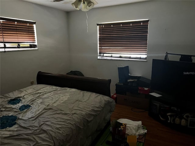 2065 Flamingo Dr, Bartow, FL 33830 - bedroom featuring wood finished floors, multiple windows, and a ceiling fan