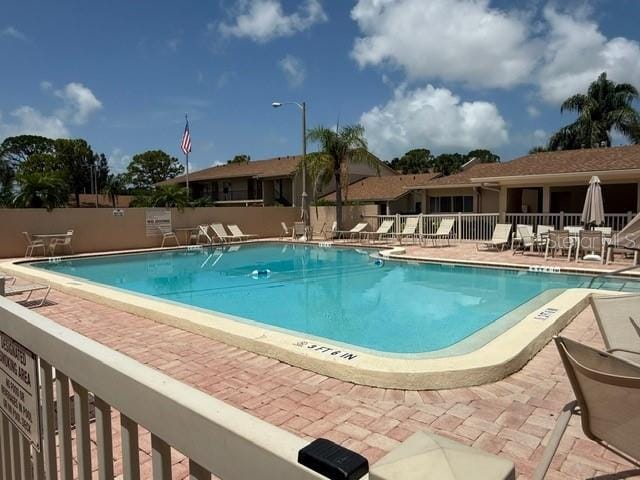 2763 Woodgate Ln Unit 111, Sarasota, FL 34231 - community pool featuring a patio area