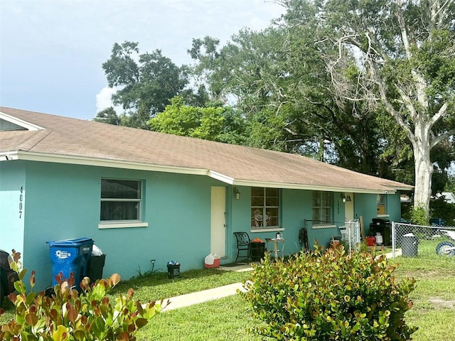 4007 7th St E, Bradenton, FL 34208 - ranch-style home with a shingled roof, covered porch, and stucco siding