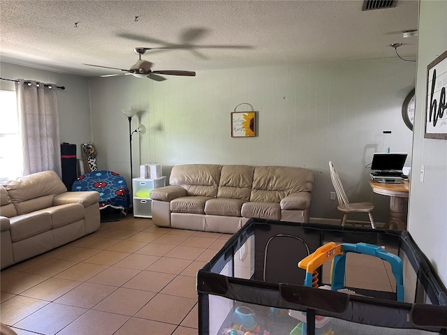 4007 7th St E, Bradenton, FL 34208 - living room featuring a ceiling fan, light tile patterned flooring, and a textured ceiling