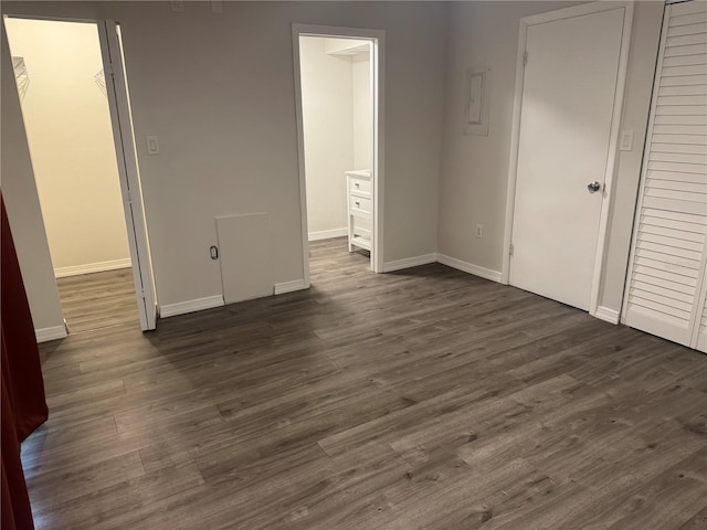 4503 3rd Street Cir W Unit 266, Bradenton, FL 34207 - unfurnished bedroom with dark wood-style floors, ensuite bathroom, and a closet