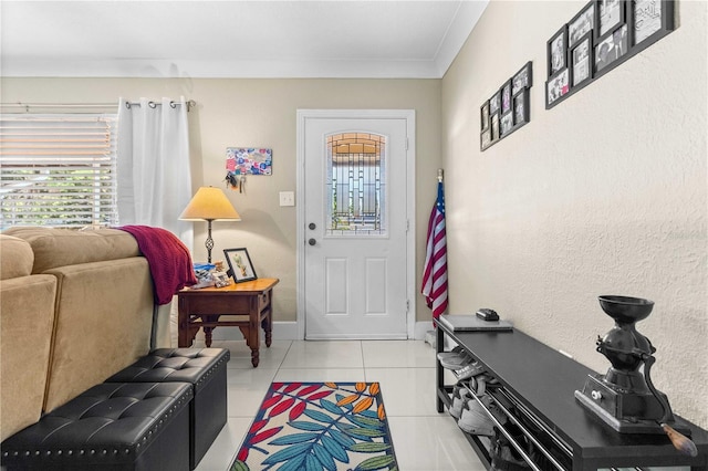 2108 Outer Dr, Sarasota, FL 34231 - entrance foyer with light tile patterned floors and crown molding