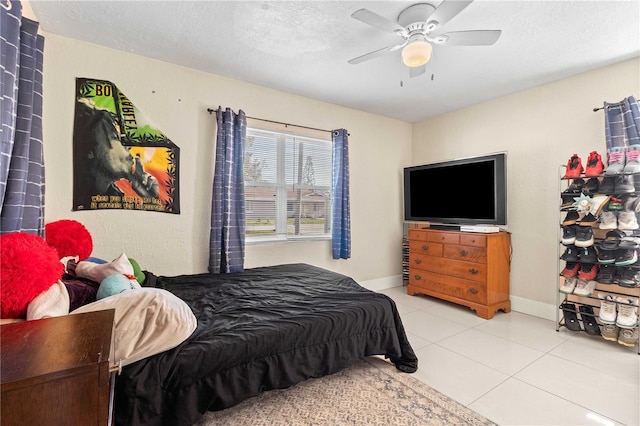 2108 Outer Dr, Sarasota, FL 34231 - bedroom featuring tile patterned floors, a textured ceiling, and ceiling fan