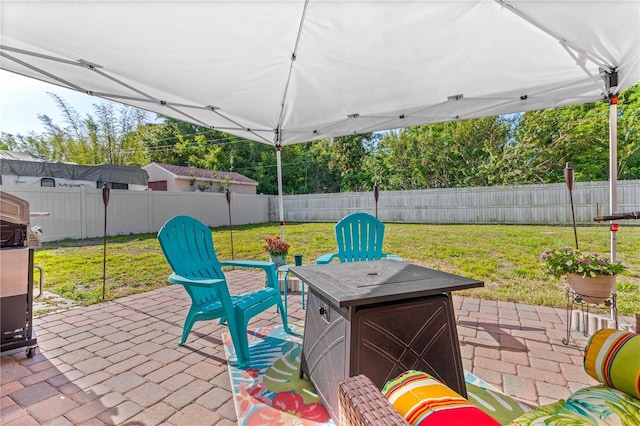 2108 Outer Dr, Sarasota, FL 34231 - fenced backyard with a patio and an outdoor fire pit