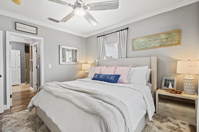 2419 29th Ave E, Palmetto, FL 34221 - bedroom featuring crown molding, wood finished floors, and a ceiling fan