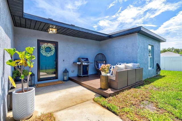 2419 29th Ave E, Palmetto, FL 34221 - property entrance featuring stucco siding, a wooden deck, and outdoor lounge area