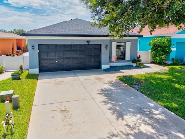 2419 29th Ave E, Palmetto, FL 34221 - ranch-style house with driveway, a garage, roof with shingles, and stucco siding
