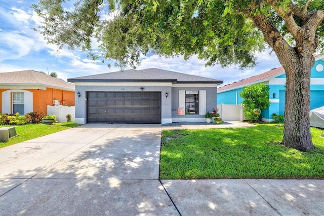 2419 29th Ave E, Palmetto, FL 34221 - view of front of property featuring concrete driveway, a garage, and stucco siding