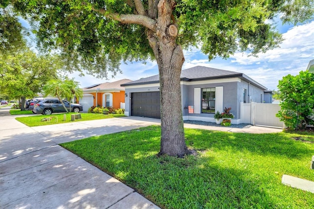 2419 29th Ave E, Palmetto, FL 34221 - ranch-style home with driveway, a garage, and stucco siding