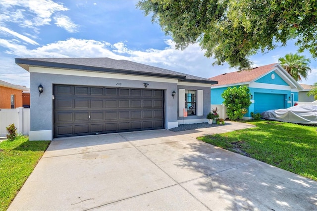 2419 29th Ave E, Palmetto, FL 34221 - single story home featuring stucco siding, concrete driveway, a front lawn, and an attached garage