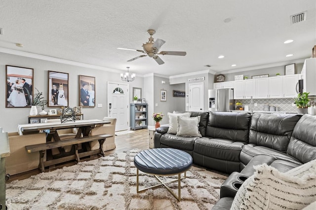 2419 29th Ave E, Palmetto, FL 34221 - living room featuring light wood-type flooring, crown molding, a ceiling fan, a chandelier, and recessed lighting