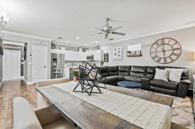 2419 29th Ave E, Palmetto, FL 34221 - living room with ceiling fan, crown molding, light wood finished floors, a textured ceiling, and recessed lighting