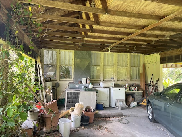 exterior space featuring washer and clothes dryer and central AC