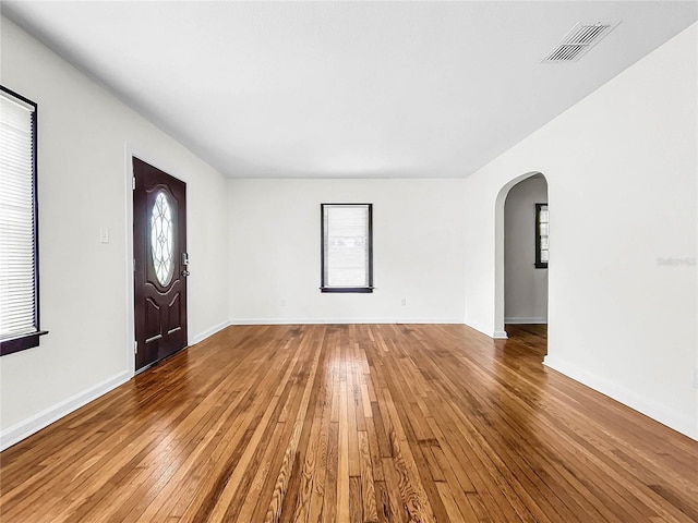 entryway featuring a healthy amount of sunlight and hardwood / wood-style floors