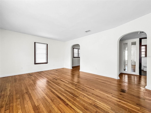 unfurnished room featuring hardwood / wood-style floors