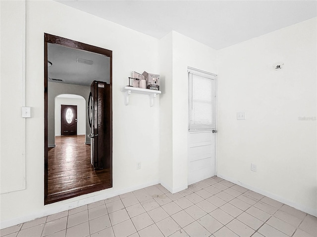 spare room featuring light hardwood / wood-style floors