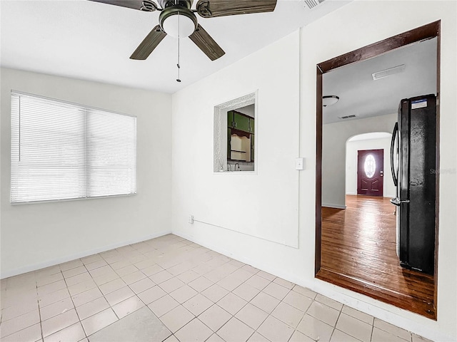 unfurnished room featuring lofted ceiling, ceiling fan, and light hardwood / wood-style floors