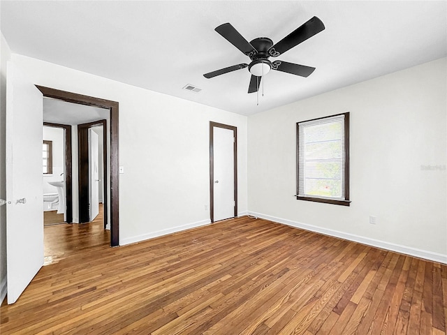 spare room with ceiling fan and hardwood / wood-style floors