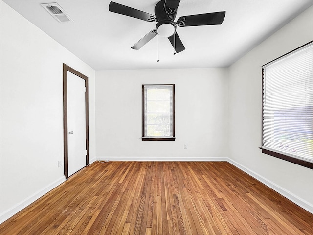 spare room featuring ceiling fan and wood-type flooring