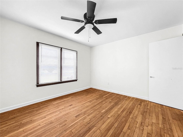 spare room featuring light hardwood / wood-style flooring and ceiling fan