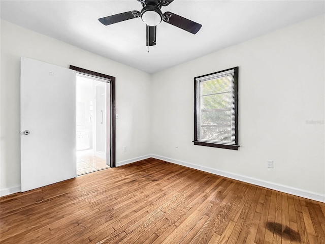 unfurnished room featuring ceiling fan and light hardwood / wood-style floors