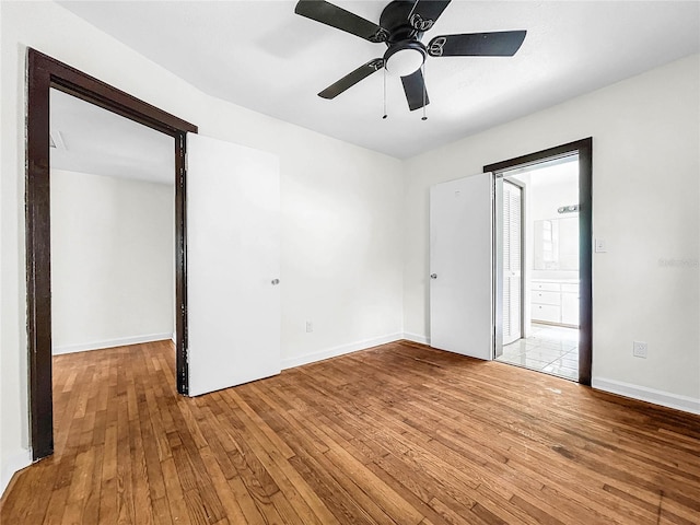 unfurnished room featuring light hardwood / wood-style flooring and ceiling fan