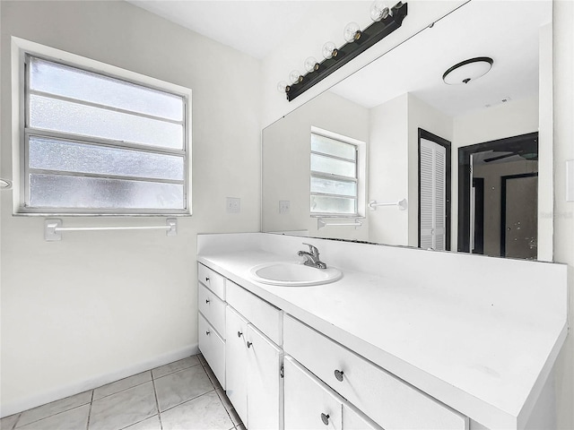 bathroom featuring plenty of natural light, vanity, and tile patterned floors