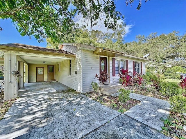 ranch-style home with a carport