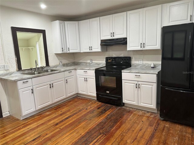 kitchen with black appliances, dark hardwood / wood-style floors, sink, and white cabinetry