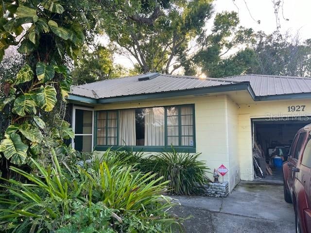 view of property exterior with a garage