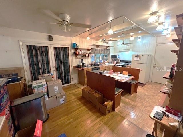 kitchen with ceiling fan and white fridge