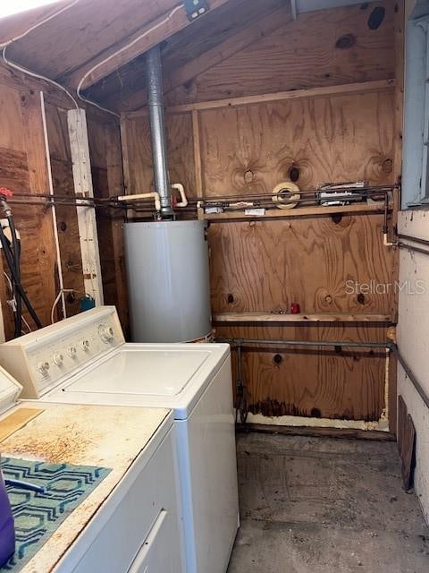 laundry room featuring gas water heater and washing machine and clothes dryer