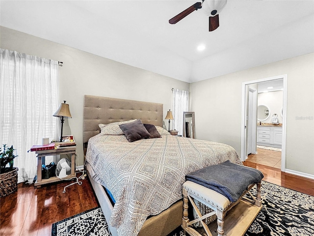 bedroom with wood-type flooring, ceiling fan, and ensuite bathroom