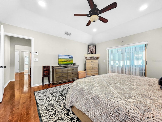 bedroom with ceiling fan and dark wood-type flooring