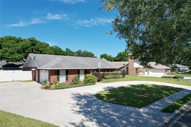 ranch-style home with a front lawn