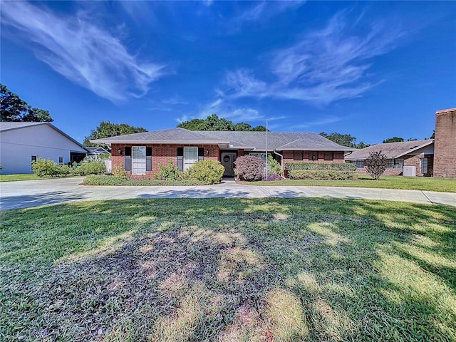 ranch-style home with a front yard