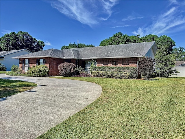 ranch-style house with a front lawn