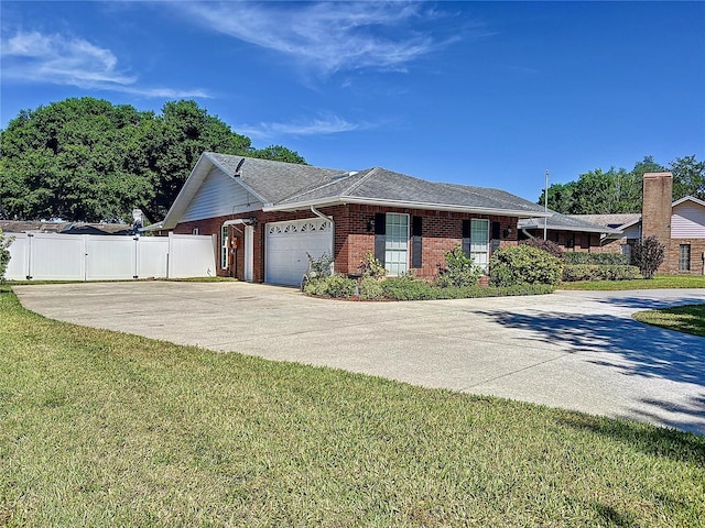 ranch-style home with a front lawn and a garage