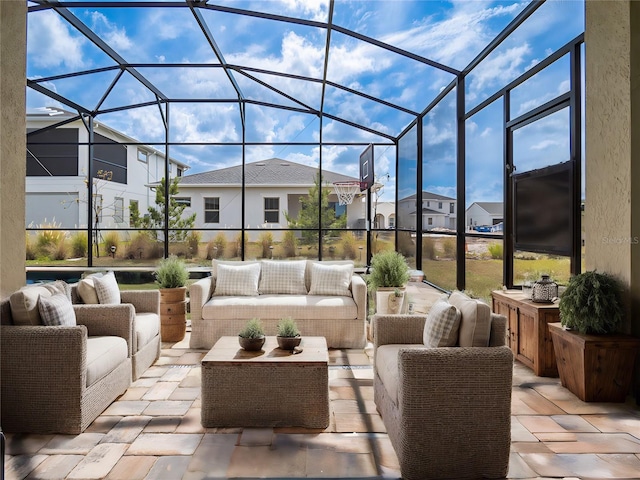 view of patio / terrace with an outdoor hangout area and glass enclosure