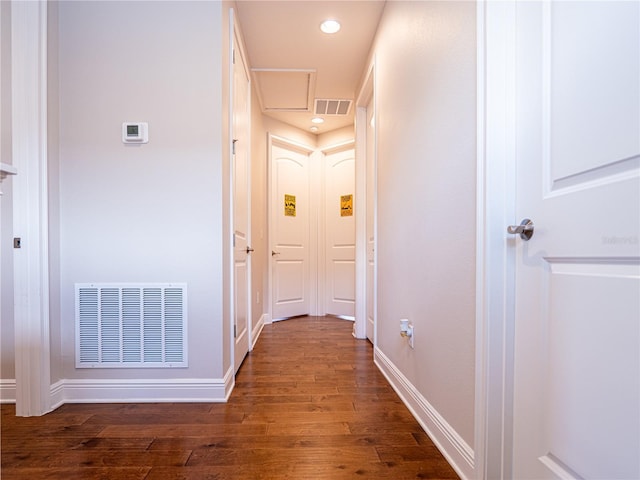 hallway with dark wood-type flooring