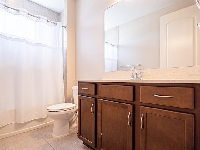 full bathroom featuring vanity, tile patterned floors, toilet, and shower / tub combo with curtain