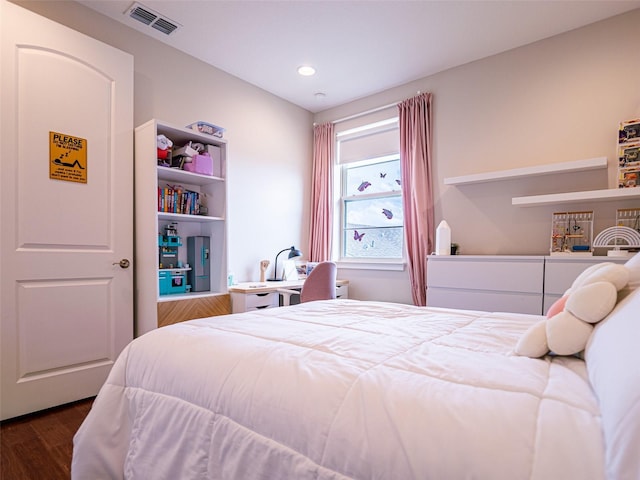 bedroom featuring dark hardwood / wood-style flooring