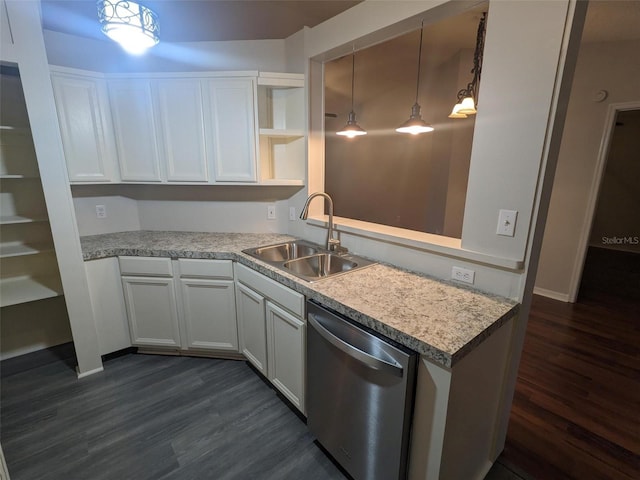 kitchen with sink, white cabinets, hanging light fixtures, stainless steel dishwasher, and dark wood-type flooring