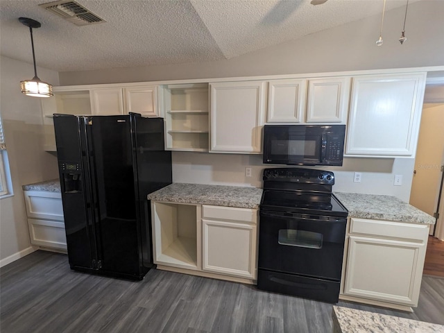 kitchen featuring pendant lighting, lofted ceiling, dark hardwood / wood-style floors, black appliances, and white cabinets