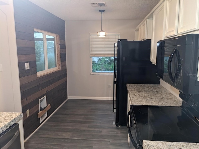 kitchen featuring white cabinetry, pendant lighting, a textured ceiling, and black appliances