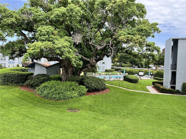 view of yard featuring a community pool