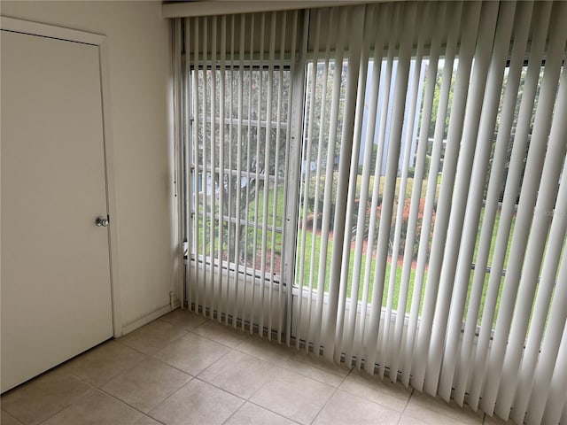 interior space featuring plenty of natural light and light tile patterned flooring