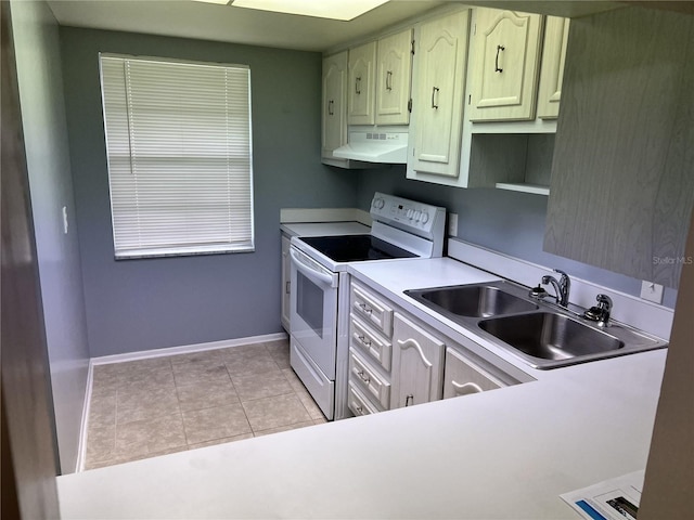 kitchen with under cabinet range hood, white electric range oven, light countertops, light tile patterned flooring, and a sink